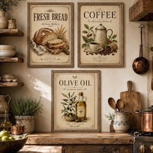 May include: Three framed vintage-style kitchen prints. The top left print says "Fresh Bread" with a loaf of bread. The top right print says "Coffee" with a coffee pot and cup. The bottom print says "Olive Oil" with a bottle and olives.