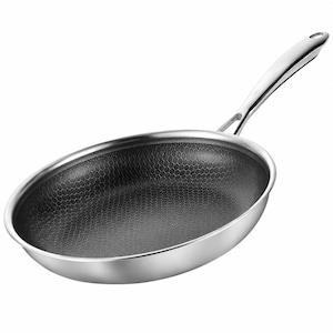 May include: A stainless steel frying pan with a long, riveted handle. The interior surface features a dark, non-stick coating with a distinct, raised hexagonal honeycomb pattern. The exterior of the pan has a polished, reflective metallic finish.