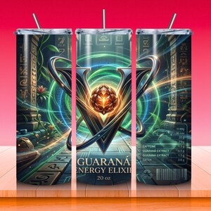 May include: A 20 oz tumbler with a vibrant design featuring a large 'V' shape with a central, glowing orb. The design includes green and blue energy lines, and the text 'GUARAN&Aacute; ENERGY ELIXIR'. The tumbler has a straw.