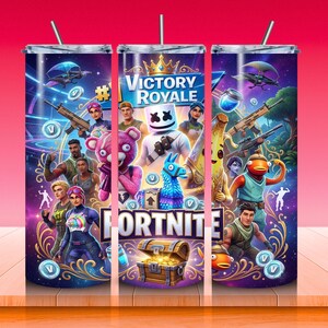 May include: A stainless steel tumbler featuring a vibrant Fortnite design. The design includes characters, the words "Victory Royale" and "Fortnite", and a treasure chest. The tumbler has a straw and is set against a gradient background.