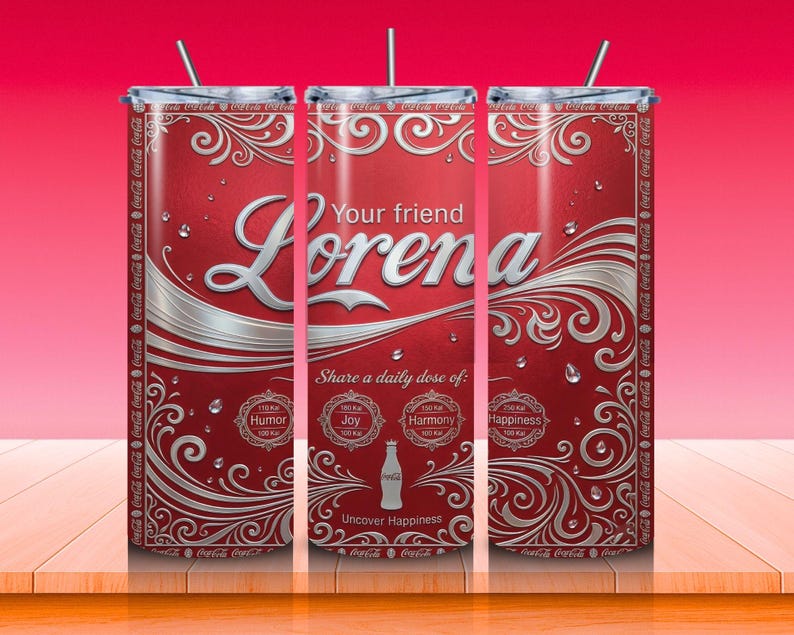 May include: A set of three red tumblers with silver accents and a straw. The tumblers feature the name "Lorena" in a stylized font, along with the text "Your friend" and "Share a daily dose of: Humor, Joy, Harmony, Happiness". The design includes decorative swirls and the Coca-Cola logo.
