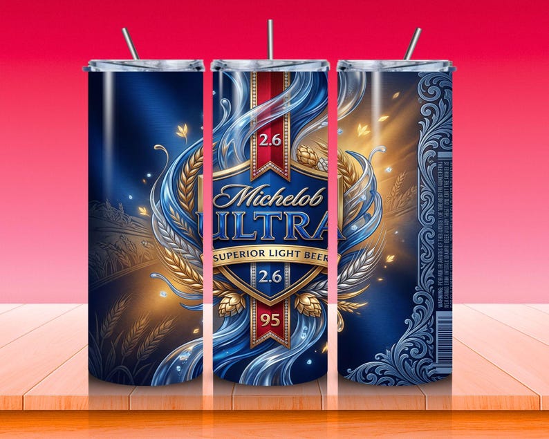 May include: A stainless steel tumbler featuring a blue and gold design with the words "Michelob Ultra Superior Light Beer". The design includes wheat, water, and the numbers "2.6" and "95". The tumbler has a silver straw.