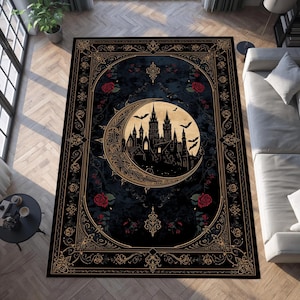 May include: A rectangular black rug with a gothic design. The rug features a crescent moon with a castle silhouette, bats, and red roses. Gold ornate borders frame the central design.