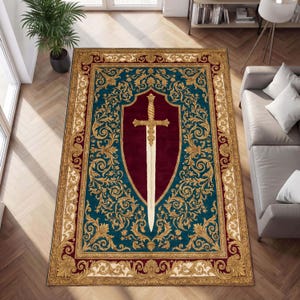 May include: Rectangular area rug with a teal background and a central design featuring a burgundy shield and a white sword. The shield and sword are framed by gold scrollwork. The rug has a gold and burgundy border.