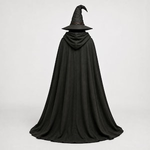 May include: A floor-length black cloak featuring a hood and a matching pointed hat. The cloak is made of a solid dark fabric that drapes down to the floor, while the hat includes a dark band around the base of the crown, creating a cohesive set.