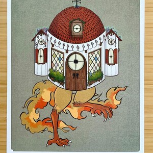 May include: A rectangular art print titled POKE YAGA 8x10 PRINT featuring a whimsical house with a red domed roof, a central door, and two side wings, supported by two large, clawed, orange-brown bird-like legs surrounded by stylized orange flames.