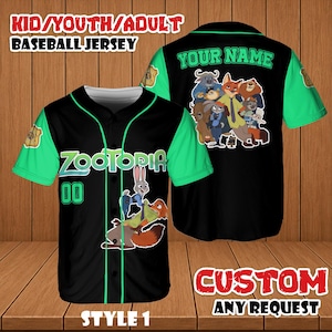 May include: Black baseball jersey with green sleeves and accents. Features the word "ZOOTOPIA" and the number "00" on the front. The back of the jersey has the text "YOUR NAME" and a graphic of characters. The jersey is labeled "STYLE 1".