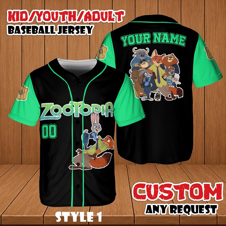 May include: Black baseball jersey with green sleeves and accents. Features the word "ZOOTOPIA" and the number "00" on the front. The back of the jersey has the text "YOUR NAME" and a graphic of characters. The jersey is labeled "STYLE 1".