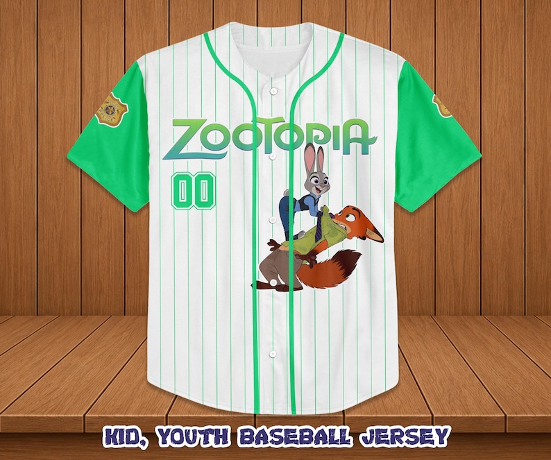 May include: White baseball jersey with green sleeves and accents. Features the word "Zootopia" in green and blue, along with a cartoon image of Judy Hopps and Nick Wilde. The number "00" is in green. The text "KID, YOUTH BASEBALL JERSEY" is at the bottom.