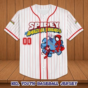 May include: White baseball jersey with red pinstripes and accents. Features the text "SPIDEY AND HIS AMAZING FRIENDS" and a graphic of the characters. Includes the number "00" in red. The sleeves have a small logo.