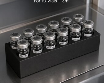 May include: A black rectangular fridge vial holder designed for 10 vials of 3ml. The holder contains ten clear glass vials with silver caps, each labeled with the word PEPTIDE. Text on the image reads FRIDGE VIAL HOLDER, For 10 Vials – 3ml, ORGANIZED STORAGE, FRIDGE SAFE, DURABLE & COMPACT, and COUPLE3D STUDIO.