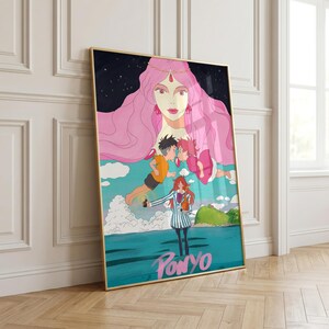 May include: Framed art print featuring a colorful illustration from the animated film "Ponyo." The artwork depicts characters in a vibrant scene with a large pink-haired figure, two children, and a girl in a striped coat. The title "Ponyo" is written in pink.