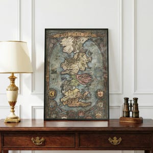 May include: Framed map of Westeros, featuring a detailed depiction of the fictional continent. The map has a vintage aesthetic with a blue and tan color scheme. The frame is black, and the map includes various symbols and text.