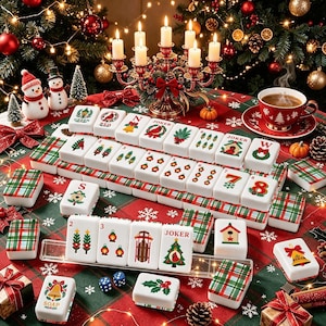 May include: A set of white mahjong tiles featuring colorful Christmas-themed illustrations such as cardinals, bells, sleds, and lanterns. The tiles are arranged on a red and green plaid tablecloth alongside two blue dice and a clear tile rack.