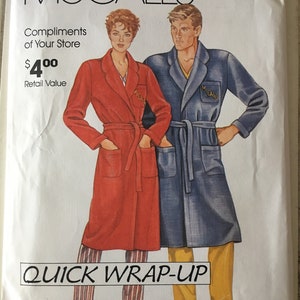 May include: McCall's sewing pattern envelope featuring illustrations of a person in a red robe and another in a blue robe. The text "QUICK WRAP-UP" is displayed at the bottom. The McCall's logo is at the top.