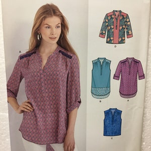 May include: A New Look sewing pattern envelope featuring a woman wearing a pink floral print blouse. The envelope includes illustrations of different blouse designs, with the text "NEW LOOK" and size information.