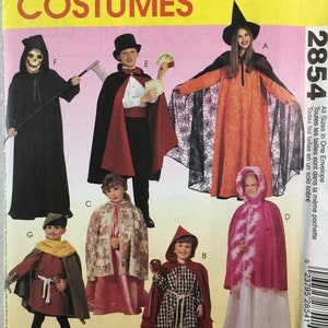 May include: McCall's Costumes pattern envelope featuring various Halloween costume designs. The costumes include a Grim Reaper, a magician, a witch, and other characters. The envelope has the text "Easy 2 Hour" and the pattern number 2854.