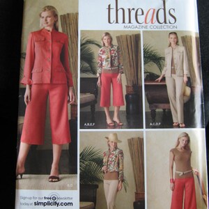 May include: Simplicity sewing pattern featuring a magazine collection. The cover showcases various women's outfits, including a red suit with culottes, a floral jacket with red pants, and a beige suit. The pattern includes sizes 6-14.