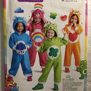 May include: Care Bears Unlock the Magic sewing pattern for children's costumes. The pattern includes four different Care Bear costumes: blue with a cloud, pink with a rainbow, green with a shamrock, and orange with a heart. The pattern is for sizes 1/2-4.