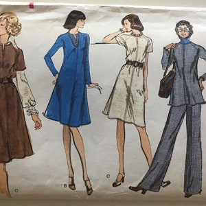 May include: Vintage Vogue Patterns sewing pattern envelope featuring illustrations of four different outfits. The envelope includes the text "Very Easy Vogue Patterns" and "suitable for knits". The outfits include dresses and a pantsuit.