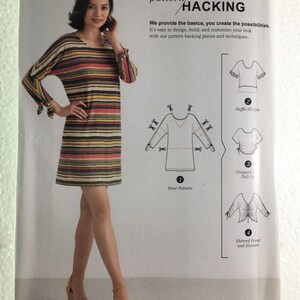 May include: Simplicity pattern hacking sewing pattern. The pattern includes a woman wearing a striped dress with long sleeves. The pattern offers options for a ruffle hi-low, cropped pull-up, and shirred front and sleeves. Size U.S. XXS-XXL.