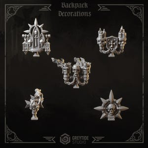 May include: A set of five grey miniature backpack decorations featuring gothic motifs including skulls, crosses, candles, and chains. The collection includes ornate toppers with pointed spikes and religious iconography, designed for tabletop gaming figures.
