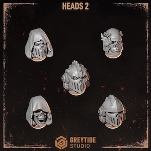 May include: Five grey miniature resin heads labelled HEADS 2 by Greytide Studio. The set includes two hooded skull heads, one bare skull head with a laurel wreath, one armoured helmet with a spiked crest, and one armoured helmet with a smooth visor.