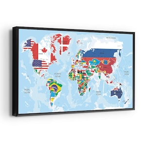 May include: A rectangular wall art piece featuring a world map where each country is filled with its respective national flag. The map is set against a light blue background with black text labels for oceans and major regions, framed in black.