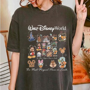Vintage wash charcoal t-shirt with classic Walt Disney World branding and multi-character retro graphic.