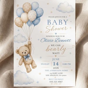 May include: A rectangular baby shower invitation card featuring a brown teddy bear holding a cluster of blue and beige balloons. The text reads: PLEASE JOIN US FOR A BABY SHOWER HONORING MOM TO BE OLIVIA BENNETT WE CAN bearly WAIT! JUNE FRIDAY 14 2026.