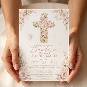 May include: A rectangular baptism invitation card featuring a central cross made of pink and white roses, surrounded by floral borders and white doves. The text includes the name Sophia Marie, the date August 22, and event details for Saint Mary Catholic Church.