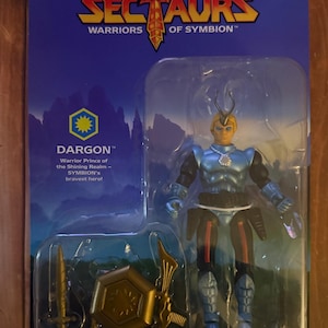 May include: A Sectaurs action figure of Dargon, the Warrior Prince of Symbion, in a sealed package. The figure is blue, black, and gold, with accessories. The packaging features the Sectaurs logo and the text "Warriors of Symbion".