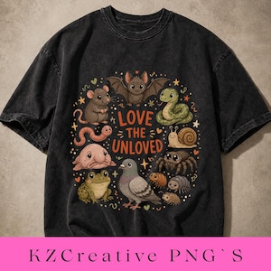 May include: Dark gray t-shirt featuring a colorful graphic of various animals, including a bat, snake, and spider, arranged in a circle. The text "LOVE THE UNLOVED" is centered within the design. The shirt has a vintage, washed appearance.