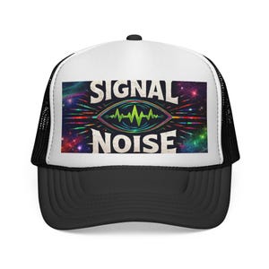 May include: A black and white trucker hat with a black brim and a white front panel. The front panel features the words "SIGNAL" and "NOISE" with a graphic of a green waveform inside an eye-shaped design, set against a colorful space-themed background.