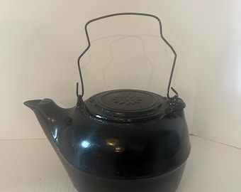 Vintage cast iron black kettle with medal handle