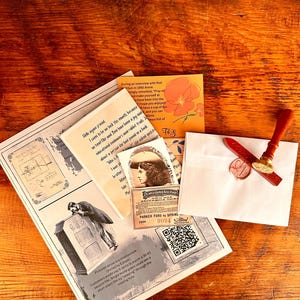May include: A collection of vintage ephemera, including a letter, postcards, and a wax seal. The letter is sealed with a red wax seal. The items are arranged on a wooden surface.