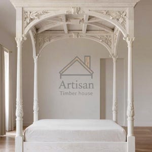 May include: A white, four-poster bed with ornate carvings and a canopy. The bed frame features detailed floral and architectural designs. The mattress is covered with a white sheet. The Artisan Timber House logo is visible on the wall.