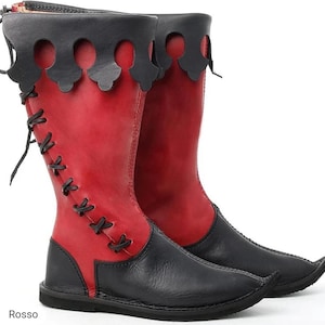 May include: A pair of mid-calf boots featuring a red shaft and black foot section. The boots have a black scalloped cuff at the top, black lace-up closures along the side, and a pointed toe design. The word Rosso is printed at the bottom left.