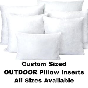 May include: A collection of white, fluffy outdoor pillow inserts in various sizes. The image displays several square and rectangular pillows, all with a clean, bright appearance. Text on the image reads "Custom Sized OUTDOOR Pillow Inserts All Sizes Available."