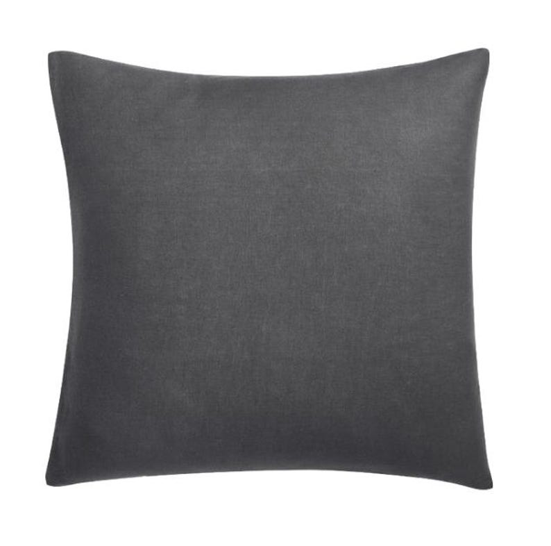May include: A square, charcoal-colored pillow with a solid, textured appearance. The pillow has a soft, matte finish and is likely made of a durable fabric. The pillow is a neutral color and can be used for home decor.