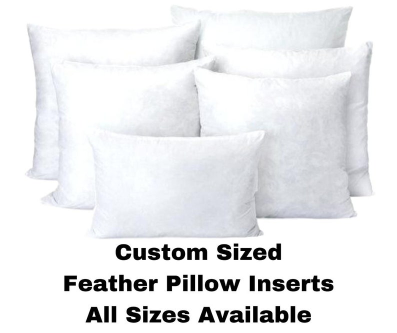 May include: A collection of white feather pillow inserts in various shapes and sizes. The image displays several fluffy, rectangular and square pillows, with the text "Custom Sized Feather Pillow Inserts All Sizes Available" at the bottom.