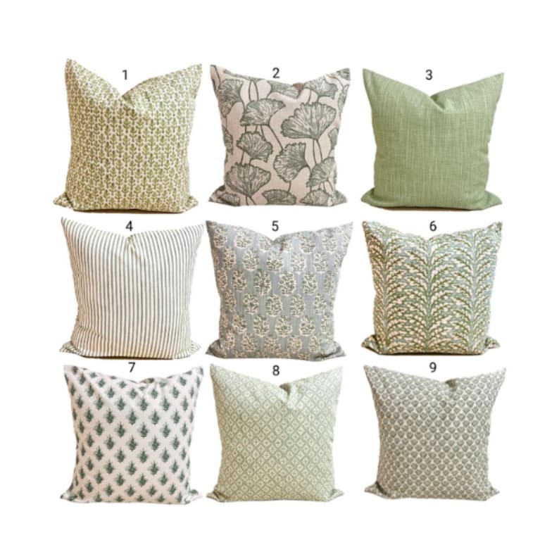 May include: A collection of nine square throw pillows arranged in a grid, each featuring distinct green and white patterns including floral prints, vertical stripes, ginkgo leaf motifs, and geometric designs, all labeled with numbers one through nine.