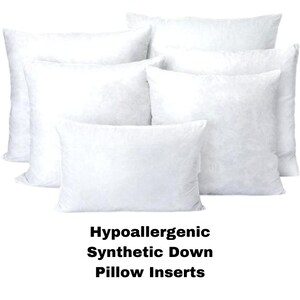 May include: A collection of white, fluffy pillow inserts. The image displays several pillows of varying sizes, arranged to showcase their shape and texture. Text at the bottom reads "Hypoallergenic Synthetic Down Pillow Inserts."