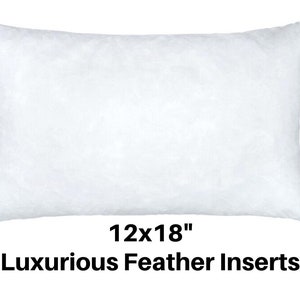 May include: A white rectangular pillow insert, measuring 12x18 inches, filled with feathers. The pillow is fluffy and soft, perfect for adding comfort to any bed or sofa. The text "Luxurious Feather Inserts" is displayed below the pillow.