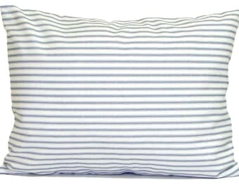 May include: Rectangular pillow with a white background and horizontal blue stripes. The pillow has a soft, textured appearance, suggesting a comfortable fabric. The stripes are evenly spaced, creating a classic, farmhouse aesthetic.