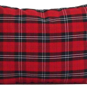 May include: A rectangular pillow with a red plaid pattern. The plaid design features thick red lines with black and white intersecting lines. The pillow is a decorative item, likely for a bed or couch.