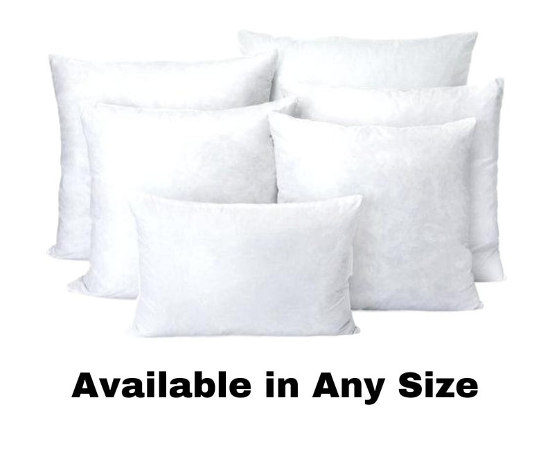 May include: A collection of white pillow inserts in various shapes and sizes. The image shows several rectangular and square pillows, all with a fluffy, filled appearance. Text at the bottom reads "Available in Any Size."
