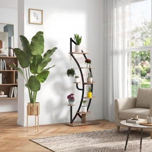 May include: A tall, curved black metal plant stand with multiple light wood-toned shelves arranged in a staggered pattern. The stand holds several small potted plants, including a hanging plant, and features a sturdy base for stability.