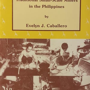 May include: A book cover with the title "GOLD FROM THE GODS: Traditional Small-Scale Miners in the Philippines" by Evelyn J. Caballero. The cover is yellow with a giraffe pattern and a collage of black and white photos of miners.