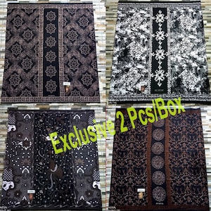 May include: Four rectangular sarongs featuring intricate batik patterns in black, white, and brown tones. Each piece displays a central vertical panel with distinct geometric, floral, or abstract motifs, finished with decorative borders and small labels.